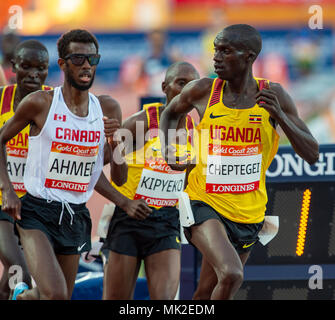 GOLD COAST, AUSTRALIA - APRIL 8: Mohammed Ahmed of Canada and Joshua Kiprui Cheptegei of Uganda competing in the Men's 5000m final at the Gold Coast 2 Stock Photo