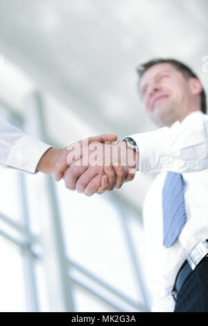 businessman shaking hands to seal a deal with his partner Stock Photo