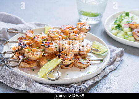 Grilled shrimp skewers with garlic honey marinade. Seafood, shellfish. Stock Photo