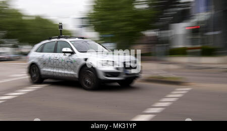 03 May 2018, Germany, Karlsruhe: An autonomous vehicle of the research centre Informatik is on the road during the opening of the 'Testfelds Autonomes Fahren' (lit. test field autonomous driving). The project is meant to sound the possibilities of driverless cars on selected tracks between Karlsruhe, Bruchsal and Heilbronn. Photo: Sebastian Gollnow/dpa Stock Photo