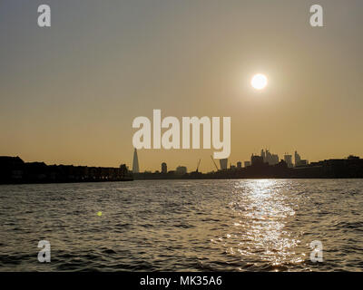 London. UK 6 May 2018 - The view of London’s skyline and tourist attractions from River Thames as the sun sets after a very hot and sunny day. The temperatures in London peaked over 25 degrees celsius. Credit: Roamwithrakhee/Alamy Live News Stock Photo