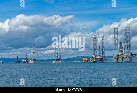 CROMARTY FIRTH SCOTLAND DECOMMISSIONED OIL RIGS WITH TALL SUPERSTRUCTURE LYING OFF CROMARTY