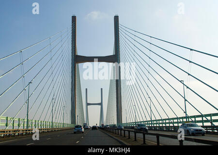 Chepstow, UK: February 24, 2018: Crossing the Severn Bridge eastward bound. Following traffic across the Severn River into England. Stock Photo