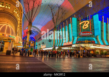 Fremont Street with many neon lights and tourists in Las Vegas Stock Photo