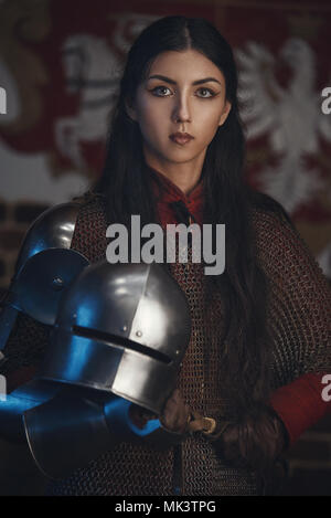 portrait of a medieval female knight in armour with sword isolated