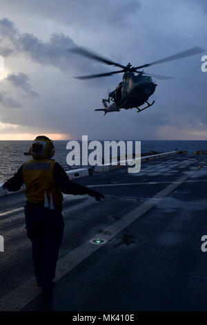 171101-N-BK384-110 MEDITERRANEAN SEA (Nov. 1, 2017) Aviation Boatswain’s Mate (Handling) 3rd Class Esmerelda Hernandez, from Corpus Christi, Texas, directs a UH-1Y Venom helicopter, attached to Marine Medium Tiltrotor Squadron (VMM) 161 (reinforced), on the flight deck of the San Antonio-class amphibious transport dock ship USS San Diego (LPD 22) Nov. 1, 2017. San Diego is deployed with the America Amphibious Ready Group and the 15th Marine Expeditionary Unit to support maritime security and theater security cooperation in efforts in the U.S. 6th Fleet area of operations. (U.S. Navy photo by M Stock Photo