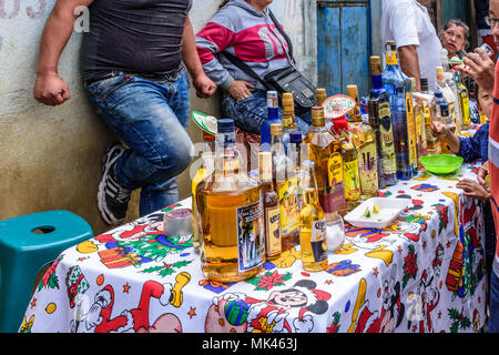 Santiago Sacatepequez, Guatemala - November 1, 2017: Makeshift streetside tequila bar during the giant kite festival on All Saints' Day. Stock Photo