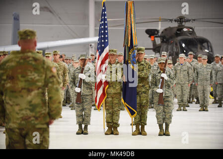 The Idaho National Guard joint honor guard post the colors during the change of command ceremony Sunday, Nov. 5, 2017 at Gowen Field to signify the transfer of authority between outgoing Commanding General Maj. Gen. Gary Sayler and the incoming Adjutant General Brig. Gen. Michael Garshak. (Air National Guard photo by Master Sgt. Becky Vanshur/Released) Stock Photo