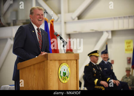 The commander in chief, Idaho National Guard, Governor C.L. 'Butch' Otter addresses the large Army and Air National Guard troop formation and distinguished guests at the change of command ceremony Sunday, Nov. 5, 2017 at Gowen Field. The ceremony signified the transfer of authority between outgoing Commanding General Maj. Gen. Gary Sayler and the incoming Adjutant General Brig. Gen. Michael Garshak. (Air National Guard photo by Master Sgt. Becky Vanshur/Released) Stock Photo