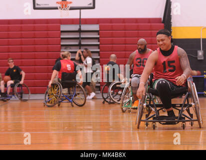 U.S. Army active duty and veteran athletes compete in wheelchair basketball for the 2017 Pacific Regional Warrior Game Trials Army Trials on Schofield Barracks, Hawaii, November 8, 2017. Approximately 80 wounded, ill or injured soldiers and veterans are in Hawaii to train and compete in a series of competitive athletic events including archery, cycling, shooting, sitting volleyball, swimming, track and field and wheelchair basketball. These competitions take place during November, which also coincides with Warrior Care Month. During Warrior Care Month we focus on activities that allow us to co Stock Photo