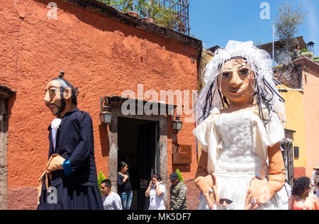 In San Miguel de Allende, a parade with two mojigangas, giant puppets Stock Photo
