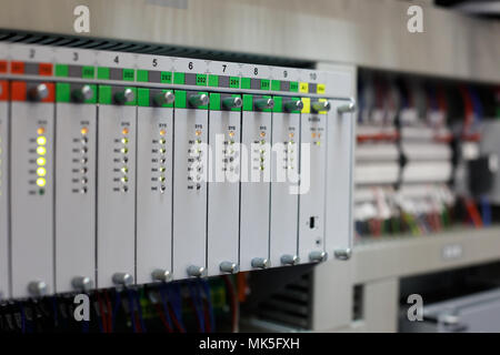 Industrial automation system with programmable controllers. Selective focus. Stock Photo