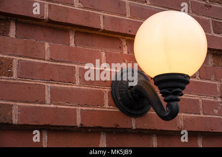 globe light on brick wall illuminated warm glow Stock Photo