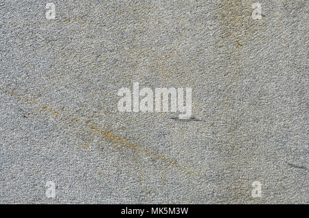 Monochromatic texture of granite surface. Detailed photo of the treated glossy granite stone, which is used as tiles for walls and floors Stock Photo