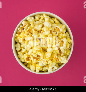 Popcorn in a pack on a red background Stock Photo