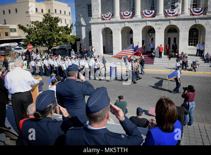 Maj. Gen. Timothy Leahy, 2nd Air Force commander, Col. Debra Lovette, 81st Training Wing commander, and Col. C. Mike Smith, 81st TRW vice commander, salute a Junior ROTC flight during the Mississippi Gulf Coast Veterans Parade Nov. 11, 2017, in Biloxi, Mississippi. Keesler Air Force Base leadership along with hundreds of Airmen attended and participated in the parade in support of all veterans past and present. Approximately 100 unique floats, marching bands and military units marched in the largest Veterans Day parade on the Gulf Coast. (U.S. Air Force photo by Tech. Sgt. Ryan Crane) Stock Photo