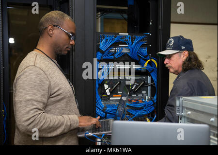 82nd Communications Squadron is a unit assigned to Sheppard Air Force Base in Texas, responsible for network and communications infrastructure in support of Air Education and Training Command. On November 14, infrastructure technicians patched a new computer into the base network to enable authentication and connectivity. The archival image documents the technical maintenance task. Stock Photo