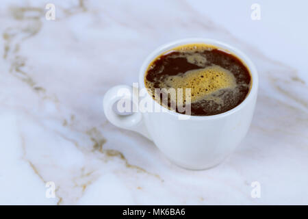 Close up white coffee cup on stone table background view Stock Photo