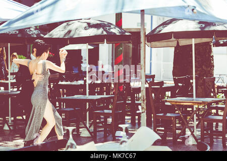 BUENOS AIRES, ARGENTINA - JANUARY 30, 2018: Unidentified couple dancing tango in the street in Buenos Aires, Argentina. Stock Photo