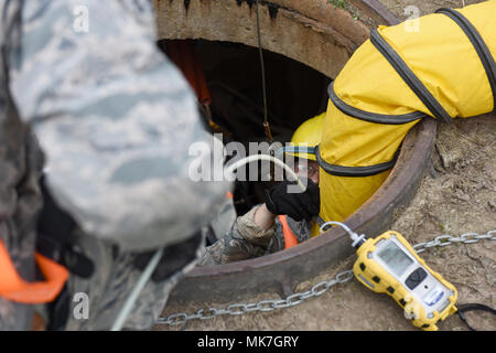 211th Engineering Installation Squadron is a Pennsylvania Air National Guard communications unit responsible for installing and maintaining network infrastructure for Air Force missions. The archival image documents an Airman handling duct rod used to pull fiber optic cables at the 193rd Special Operations Wing in Middletown, Pennsylvania, on Nov. 14, 2017, supporting a resiliency center project. Stock Photo