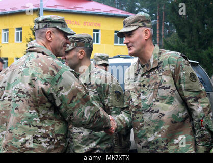 YAVORIV, UKRAINE –  Maj. Gen. John Gronski, the U.S. Army Europe deputy commander for Army National Guard, greets Lt. Col. Robert Stealey, the Joint Multinational Training Group – Ukraine (JMTG-U) chief of staff, before a JMTG-U Transfer of Authority ceremony here Nov. 22. During the ceremony Soldiers from the New York Army National Guard's 27th Infantry Brigade Combat Team (IBCT) took command of the JMTG-U from the Oklahama National Guard's 45th IBCT, who have been in Ukraine since January. (U.S. Army photo by Sgt. Alexander Rector) Stock Photo