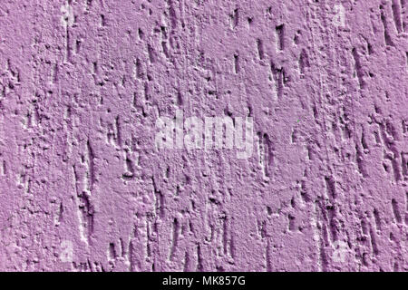 Concrete of pink plastered wall pattern. Pink wall texture grunge background. Beautiful decorative pink plastered wall or purple color painted stucco. Stock Photo