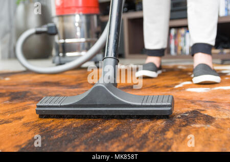 Great concept of home cleaning, vacuuming the floor, carpet. Stock Photo