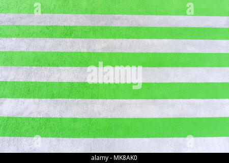 Abstract parallel stripes of beige and white on the plastered wall. Background Stock Photo