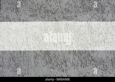Texture decorative bronze plaster imitating the old peeling wall. Obsolete gray cracked background, closeup Stock Photo