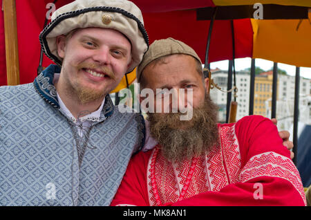 Two bearded men, stallholders at an International Hanseatic Days market, Bergen, Norway, Europe Stock Photo