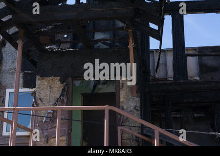 Burnt old wooden building in Russia Stock Photo