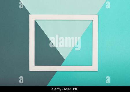 Abstract multicoloured paper texture minimalism background. Minimal geometric shapes and lines composition with empty picture frame. Stock Photo