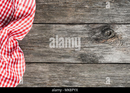 Red plaid kitchen textile on old wooden background. Cooking food Pizza Picnic background with copy space for text Stock Photo