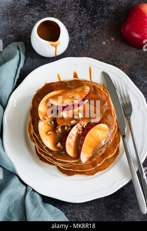 Apple Caramel Pancakes On White Plate. Homemade Tasty Pancakes. Apples With Caramel Sauce. Top View Stock Photo