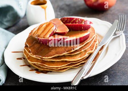 Pancakes with Caramel Apples. Homemade American Pancakes with Camarlized Apples on White Plate Stock Photo