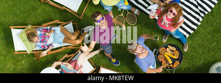 Summer barbeque party with friends in a garden Stock Photo