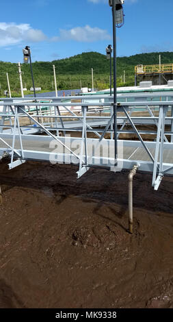 CULEBRA, Puerto Rico – The wastewater treatment plant in Culebra is powered by a Tesla generator – the large white box adjacent to the satellite dish and in front of the solar panels – on Monday, Nov. 20, 2017. There is no redundant power source for the wastewater treatment plant, so if the Tesla generator requires maintenance, the plant will cease to operate. (Photo by U.S. Army Maj. Brett Walker) Stock Photo