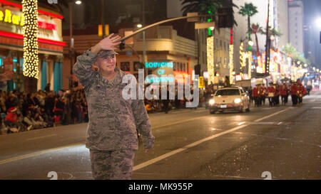 Airmen from Los Angeles Air Force and March Air Reserve Base wave to the crowd during the 86th annual Hollywood Christmas Parade in Los Angeles, Calif., Nov 26, 2017. The annual live parade is an American tradition, featuring 5,000 participants, attracting more than one million people on the streets of Hollywood and broadcasting to nationwide network televisions during the holiday season. Stock Photo