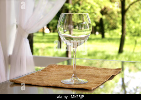 image of empty goblet on high stalk empty in gazebo Stock Photo