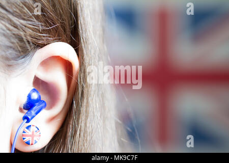 Girl is learning english with british flag abstract background concept Stock Photo