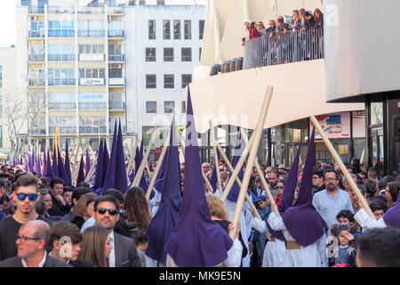Crowds watching Semana Santa aka Easter passion procession in the old town of Sevilla, Spain Stock Photo