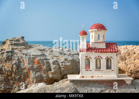 Miniature greek orthodox chapel by the sea near Chania in Crete, Greece Stock Photo