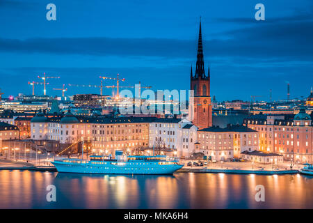 Panoramic view of famous Stockholm city center with historic Riddarholmen in Gamla Stan old town district during blue hour at dusk, Sodermalm, central Stock Photo