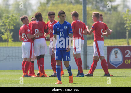 Burton upon Trent, UK. 7th May, 2018. Daniel Tesker (Israel) walks away as the Switzerland players celebrate taking a two-nil lead during the 2018 UEFA European Under-17 Championship Group A match between Switzerland and Israel at St George's Park on May 7th 2018 in Burton upon Trent, England. Credit: PHC Images/Alamy Live News Stock Photo
