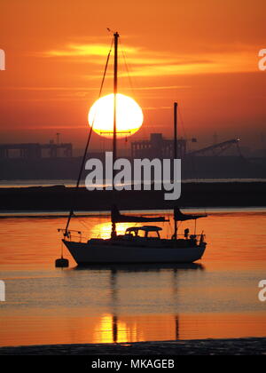 Queenborough, Kent, UK. 7th May, 2018. UK Weather: a golden sunset in Queenborough, Kent as the early May bank holiday weather breaks temperature record. Credit: James Bell/Alamy Live News Stock Photo