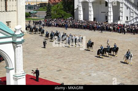 Moscow, Russia. 07th May, 2018. Russian President Vladimir Putin watches a review of the Presidential Regiment to mark his fourth inauguration on Cathedral Square in the Kremlin Grand Palace May 7, 2018 in Moscow, Russia. Putin was sworn-in for the forth time as the President of the Russian Federation. (Kremlin Pool via Credit: Planetpix/Alamy Live News Stock Photo