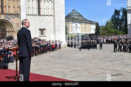 Moscow, Russia. 07th May, 2018. Russian President Vladimir Putin watches a review of the Presidential Regiment to mark his fourth inauguration on Cathedral Square in the Kremlin Grand Palace May 7, 2018 in Moscow, Russia. Putin was sworn-in for the forth time as the President of the Russian Federation. (Kremlin Pool via Credit: Planetpix/Alamy Live News Stock Photo