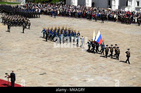 Moscow, Russia. 07th May, 2018. Russian President Vladimir Putin watches a review of the Presidential Regiment to mark his fourth inauguration on Cathedral Square in the Kremlin Grand Palace May 7, 2018 in Moscow, Russia. Putin was sworn-in for the forth time as the President of the Russian Federation. (Kremlin Pool via Credit: Planetpix/Alamy Live News Stock Photo