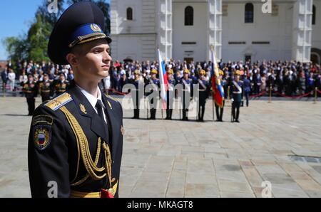 Moscow, Russia. 07th May, 2018. Russian President Vladimir Putin watches a review of the Presidential Regiment to mark his fourth inauguration on Cathedral Square in the Kremlin Grand Palace May 7, 2018 in Moscow, Russia. Putin was sworn-in for the forth time as the President of the Russian Federation. (Kremlin Pool via Credit: Planetpix/Alamy Live News Stock Photo