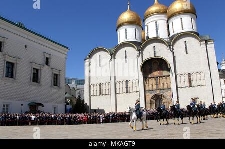 Moscow, Russia. 07th May, 2018. Russian President Vladimir Putin watches a review of the Presidential Regiment to mark his fourth inauguration on Cathedral Square in the Kremlin Grand Palace May 7, 2018 in Moscow, Russia. Putin was sworn-in for the forth time as the President of the Russian Federation. (Kremlin Pool via Credit: Planetpix/Alamy Live News Stock Photo